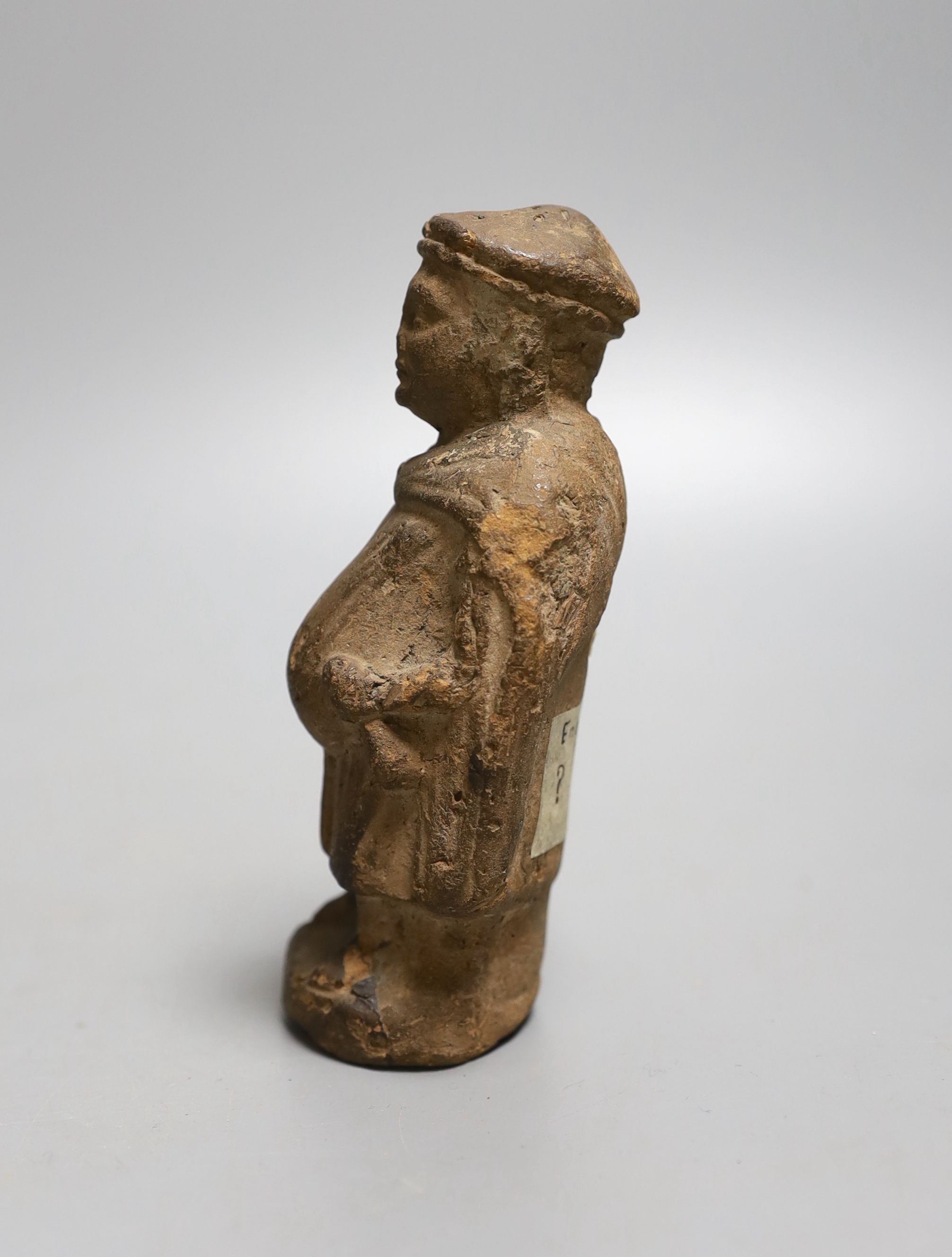 A terracotta figure of a man, possibly possibly mediaeval 13th century - 11cm tall